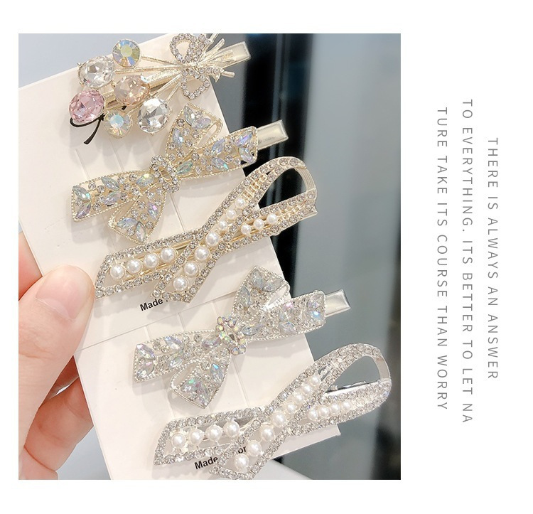 Set di fermagli per capelli eleganti con fiocco perle e cristalli_voghion.com