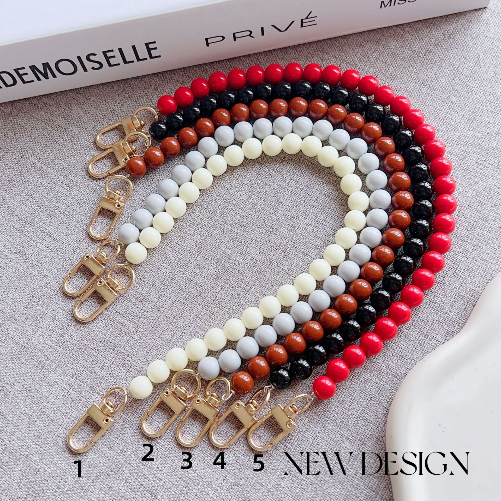 Nuevo estilo japonés y coreano cadena de cuentas de color sólido pulsera corta llavero bolsa de accesorios de cadena de perlas de todo fósforo cordón transfronterizo