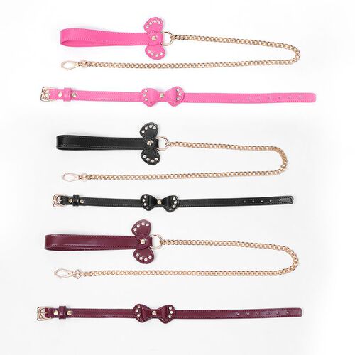 Erotic SM sex toys: leather collar with bow, leash chain, and role-play maid-themed adult sexy accessories