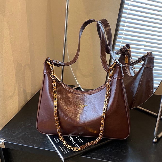 Bolsos de brazo de alta sensación de mujer 2025 nuevo nicho retro cera petot bolso cadena de hombro mochila