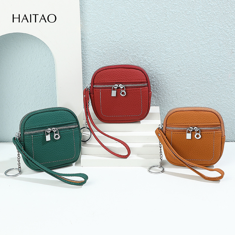 Nuevo lindo bolso de cambio de mano multifuncional simple sensación de alto nivel de doble cremallera lápiz labial bolso de tarjeta pequeña cartera