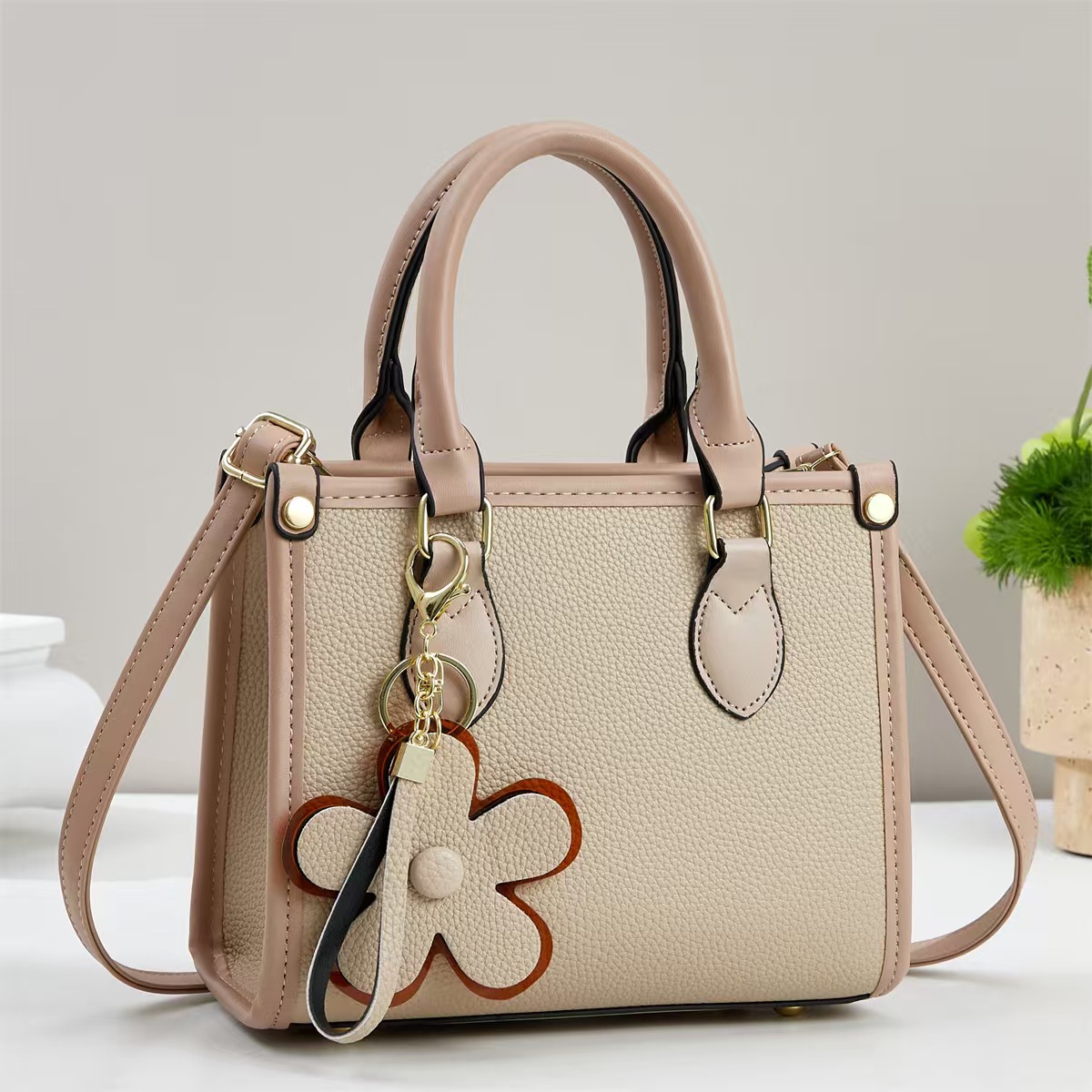 Temperamento exquisito bolso de mano mujer 2025 otoño moda versátil bolso de hombro flor decoración inclinada bolso de mano transfronterizo