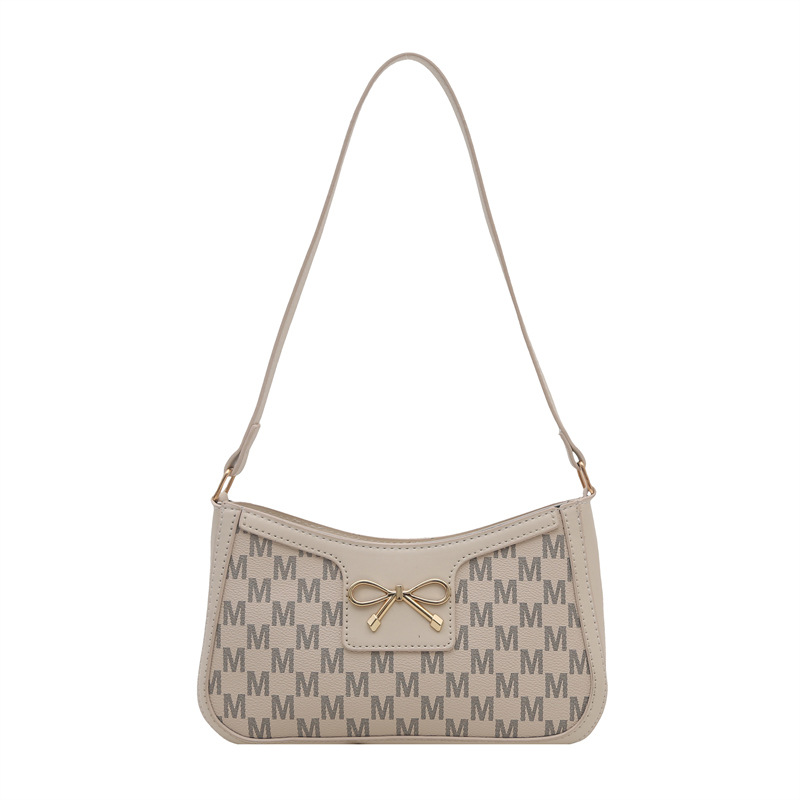 Cosmetía coreana estilo de moda textura arco de moda primavera 2025 nuevo estilo extranjero de viaje brazo bolso de hombro para mujeres