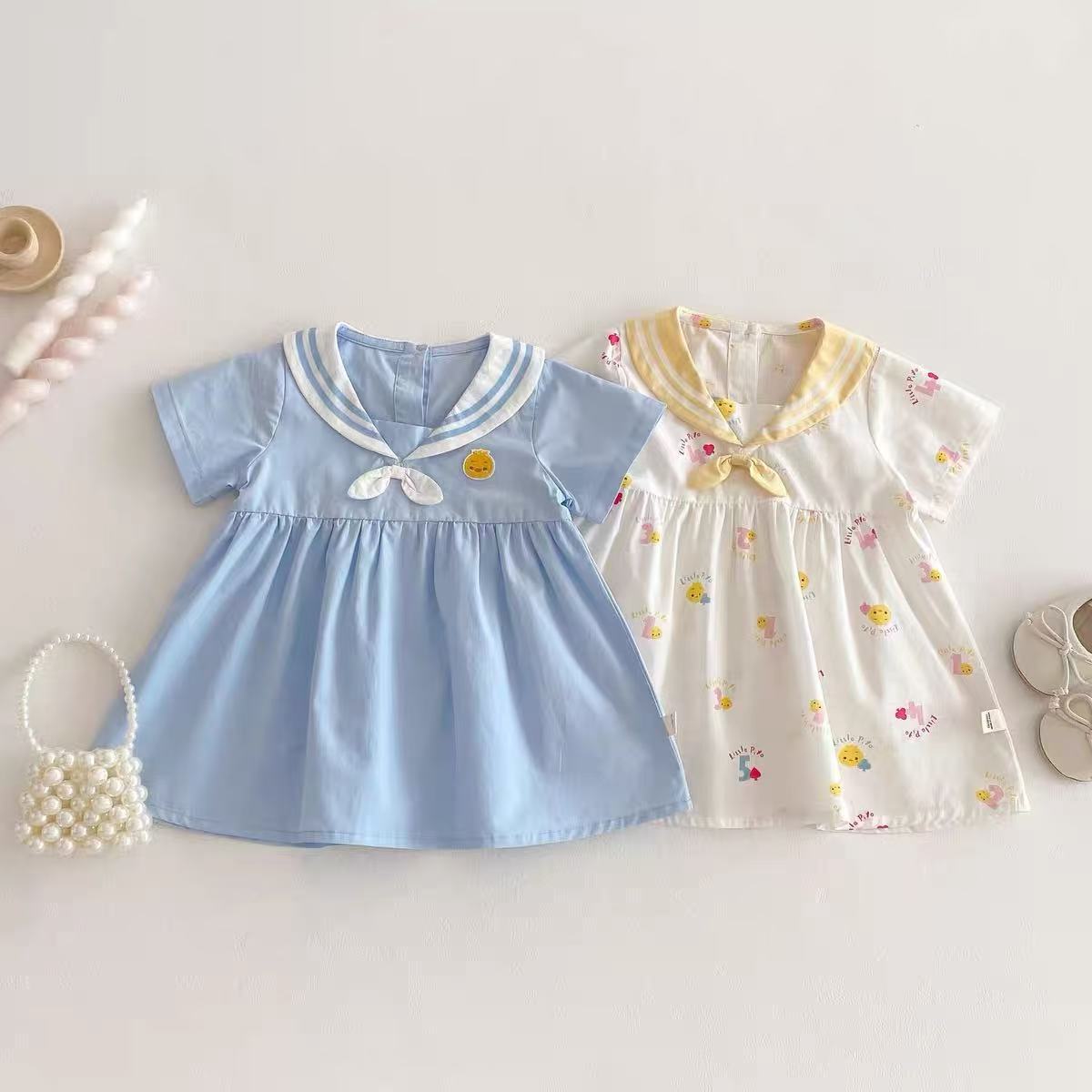 Vestido súper lindo para niñas nuevo verano bebé lindo vestido de manga corta de dibujos animados de verano azul marino