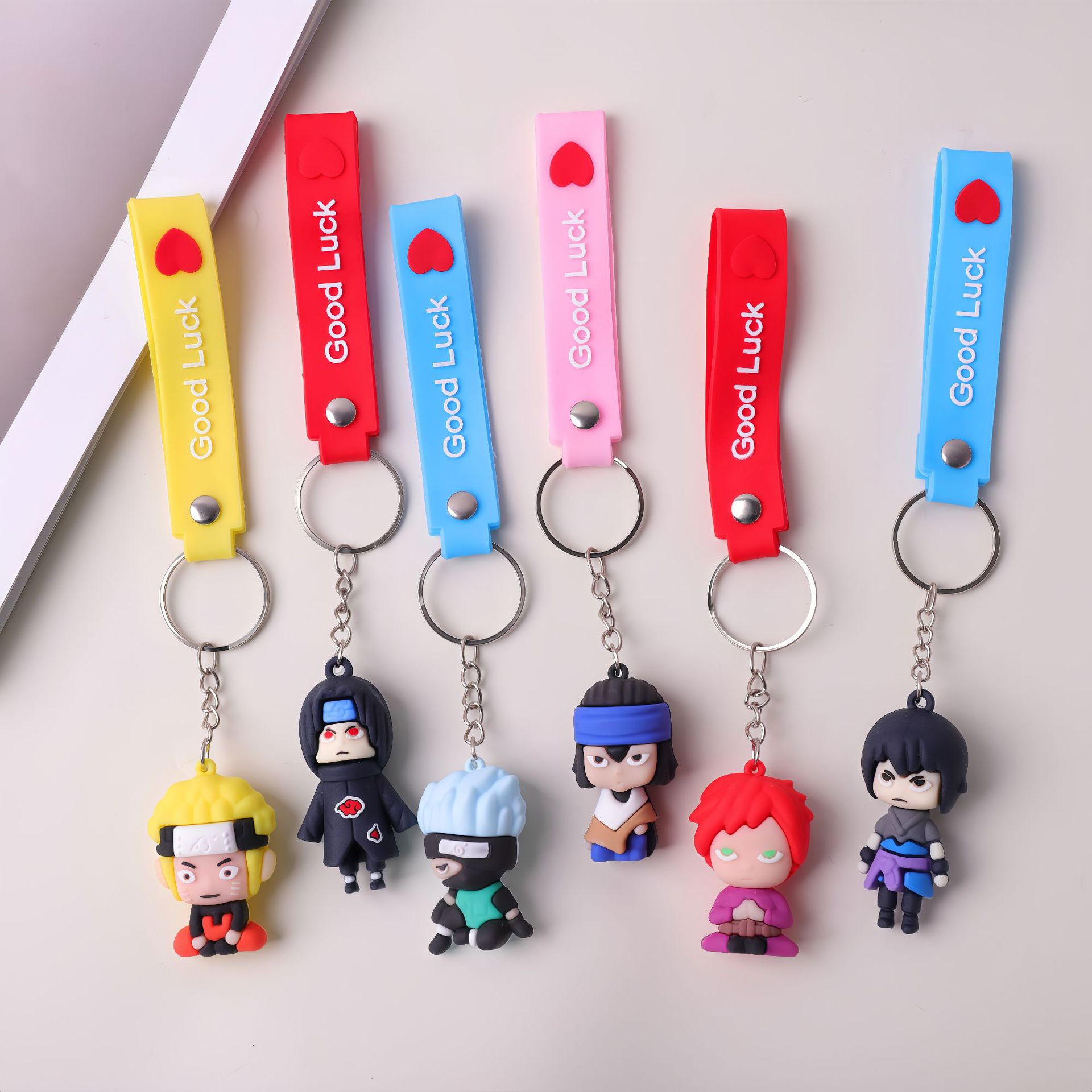 Nuevo Naruto colgante llavero cadena caja ciega animado moda juegan a mano decoración de escritorio accesorios pequeños al por mayor
