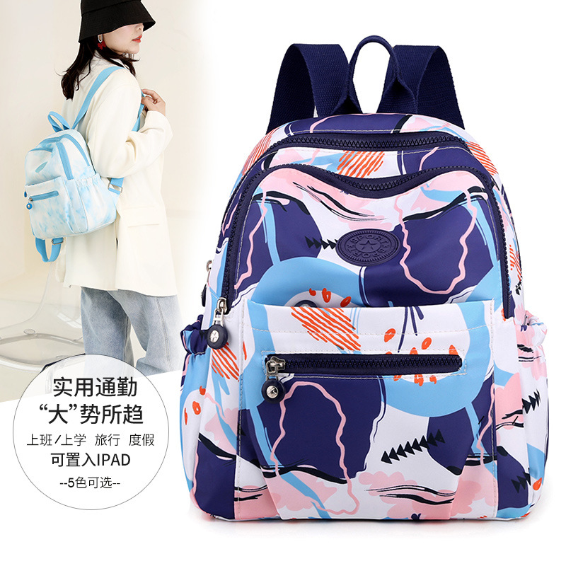 Mochila al por mayor de las mujeres 2022 nueva mochila de tela Oxford fresca dulce moda casual mochila de viaje ligero