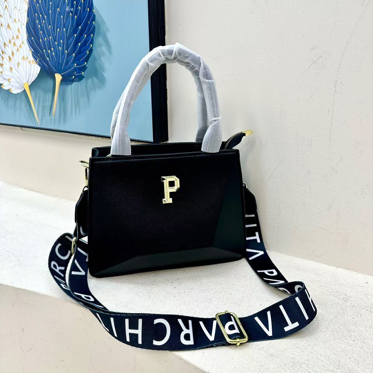 Bolsos transfronterizos para mujer 2025 primavera nuevo estilo bordado alfabeto Bolsos tote moda europea y americana bandolera de un solo hombro