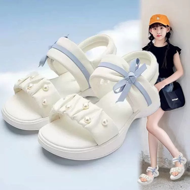 Zapatos de playa de moda de niñas versátiles 2026 verano nuevos zapatos de arco para niños Lefour zapatos de princesa huecos