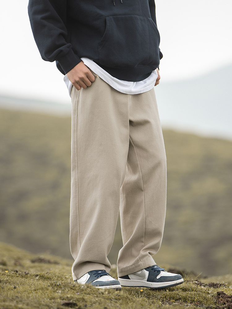 Pantalones casuales sueltos rectos de microperfil para hombre 2025 primavera nuevo estilo montaña pantalones retro de sarga de textura de algodón puro de todo fósforo