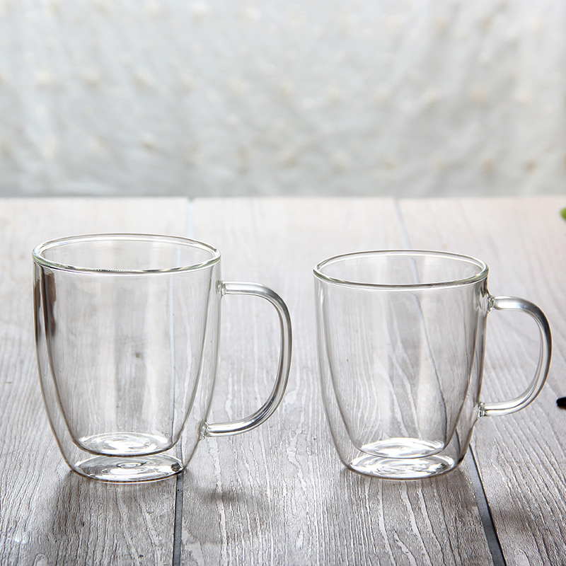 Suministro al por mayor aislado de doble capa de vidrio borosilicato creativo taza de agua taza de té transparente con mango taza de café de vidrio