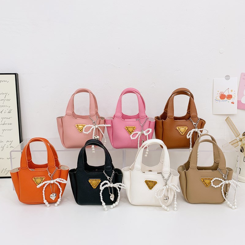 Bolso de canasta de comida portátil para niña lindo bolso de mensajero para niños con lazo de perlas mini bolso para niños de color sólido