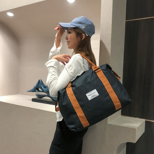 Manufacturer wholesale new travel bag LOGO shoulder bag large capacity short distance handbag luggage bag foreign trade wholesale