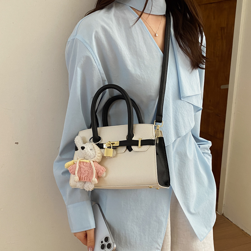 Coreano simple bolso de mano mujer 2026 primavera nueva bolsa de viaje diario texturizada bolso de mochila