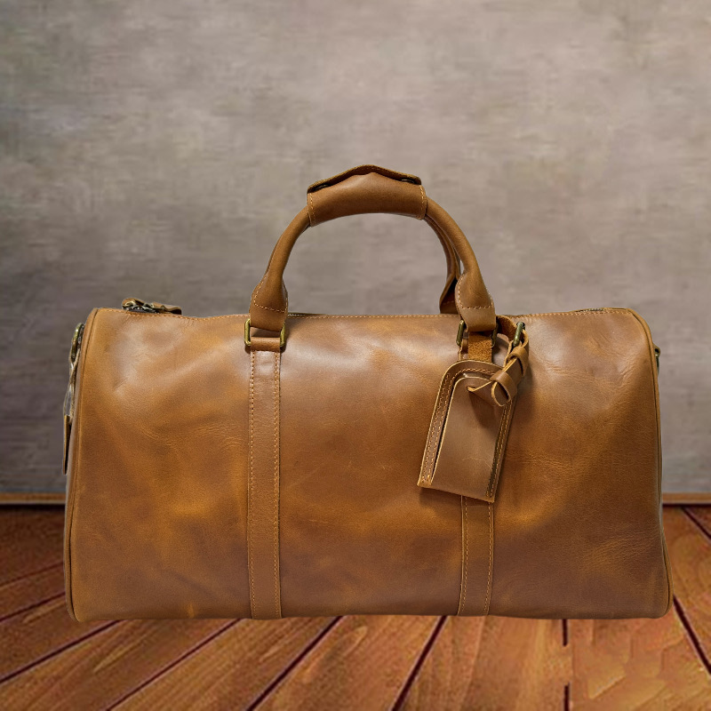 Bolso de viaje unisex de cuero transfronterizo Bolso de gimnasio de mensajero de un solo hombro Bolso de equipaje ultraligero de cuero curtido vegetal