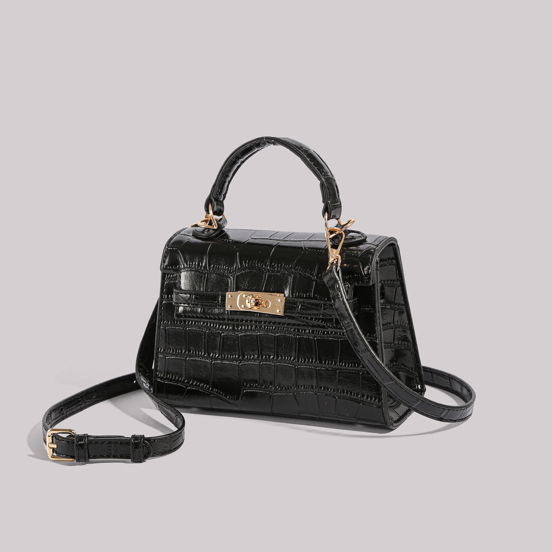 Los fabricantes venden directamente el nuevo bolso Kelly simple en 2025 con un bolso cuadrado pequeño y un bolso con patrón de cocodrilo.