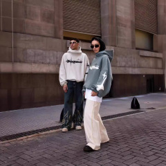 アメリカの街頭の男女のゆったりしているパーカーy 2k星のアルファベットのプリントのカジュアルなファッションのデザイン感の高い襟の上着