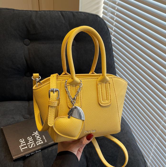 Bolso de cubo portátil de estilo caliente de moda para mujer 2025 nuevo bolso de hombro retro de nicho bolso de mensajero de moda de todo fósforo de moda