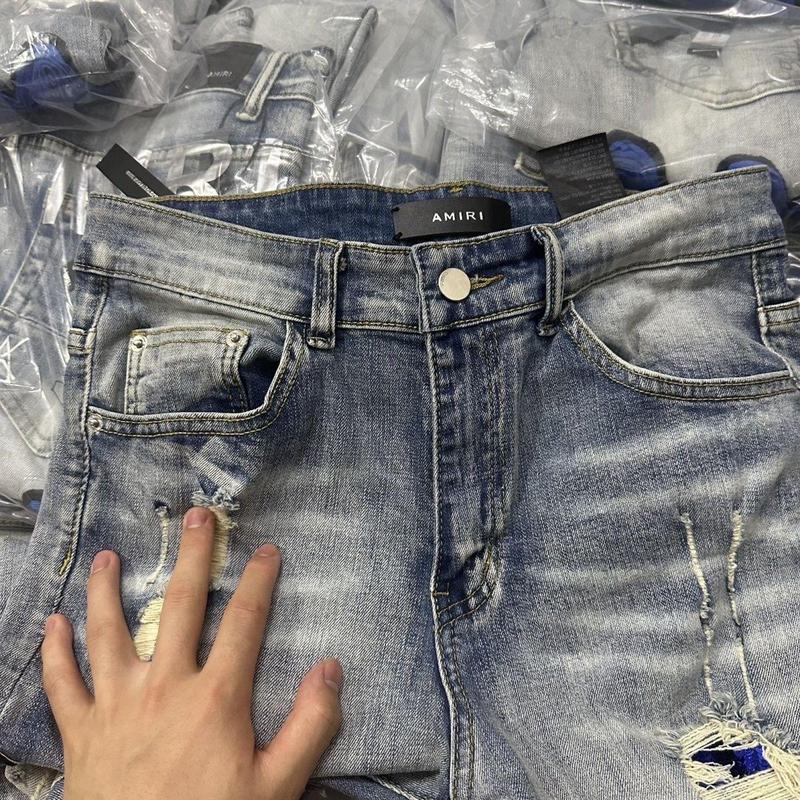 AM ヨーロッパとアメリカのトレンディなブランド春と秋の乞食の穴レターパッチワークレザー刺繍スリムジーンズメンズトレンディな小足ズボン|undefined