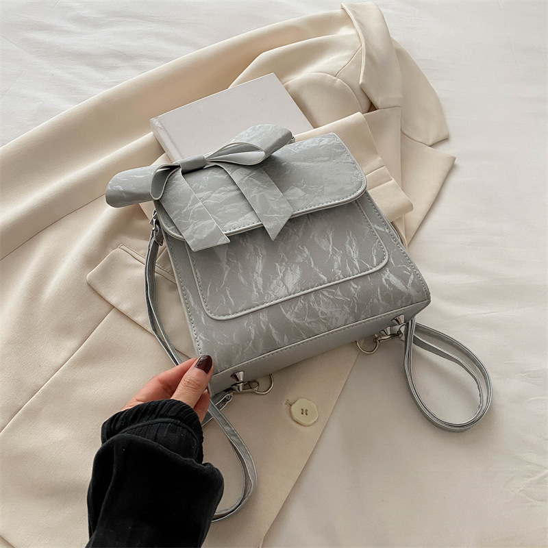 Mochila de hombro de arco para mujeres 2024 nueva moda estilo académico mochila de estilo universal bolso de mano bolso de viaje