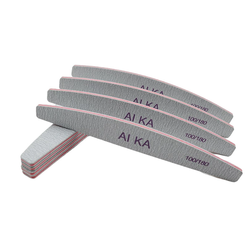 Популярный пилок-пилочка для ногтей полукруглой формы серого цвета для маникюра и ухода за ногтями.