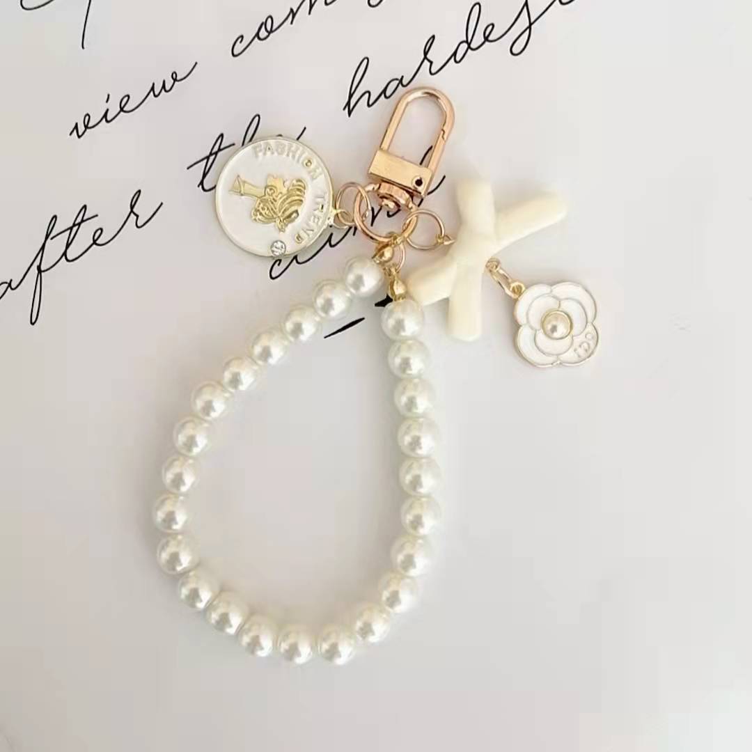 Japón y Corea del Sur color ins hecho a mano con cuentas flor llavero cordón de muñeca macaron color pétalo cordón de teléfono móvil en stock