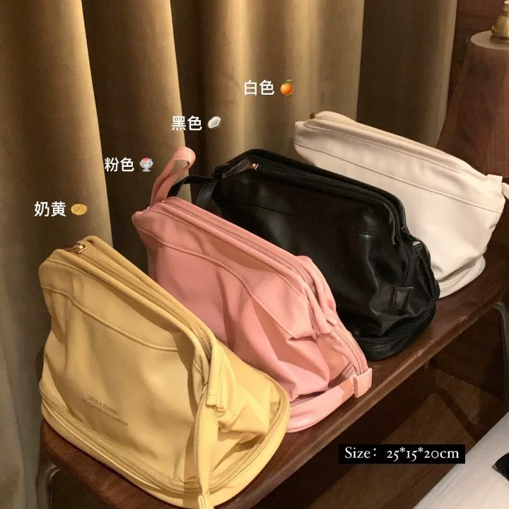 Capacious polyurethane cosmetic bag, organizer bag, handheld waterproof universal shoulder bag