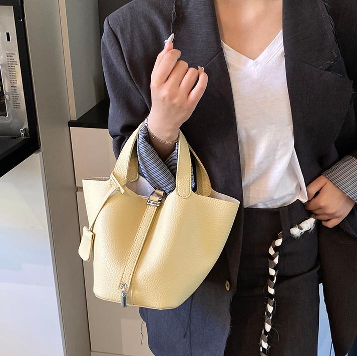 Bolsos de cesta de verduras de estilo caliente de comercio exterior para mujer 2025 nuevo bolso de cubo de ocio simple bolso femenino de alta gama de nicho