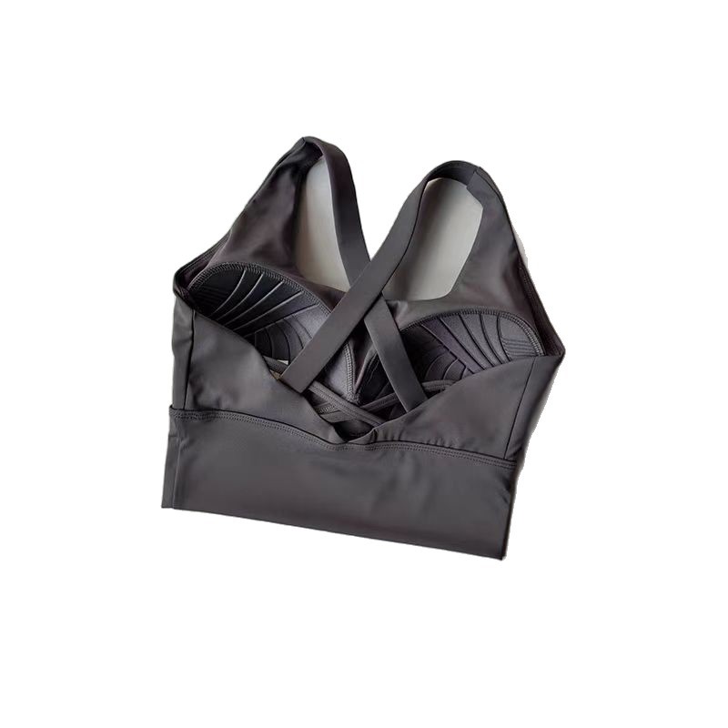 胸パッドを固定して運動する下着の女性は副乳の高強度の防震を収めてランニングのブラジャーのヨガのフィットネスの下着を閉じます。