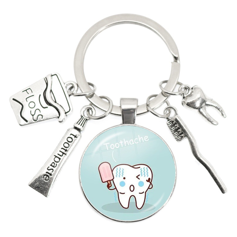 Dientes de dientes pasta de dientes forma llavero de vidrio redondo bolsa de moda colgante transfronterizo Venta caliente venta directa de la fábrica