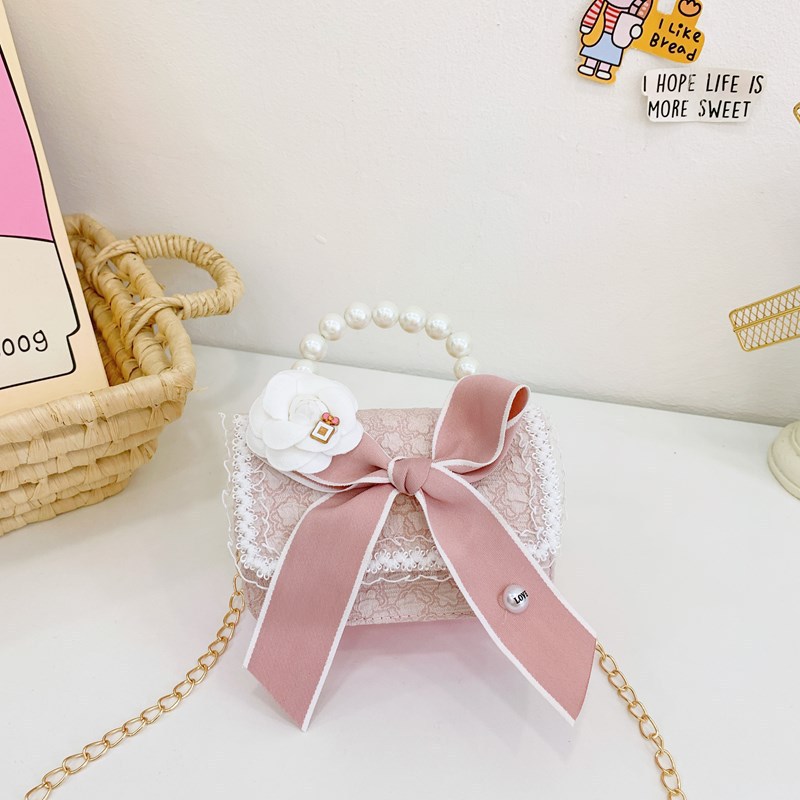 Otoño y invierno coreano arco camellia bolsas de niños de encaje de mano perlas bolsas mochilas para niñas de jardín de infantes