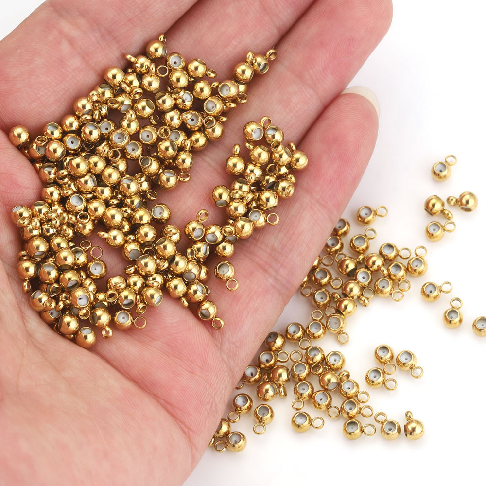 Enchufe de acero inoxidable conector de cuentas con encanto enchufe de goma Fabricación de joyas de acero de titanio redonda plana grano accesorios de la joyería al por mayor