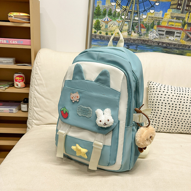 La versión coreana de las mochilas escolares de doble hombro está llena de mochilas escolares de primaria y mochilas escolares de tendencia de la escuela secundaria de gran capacidad.