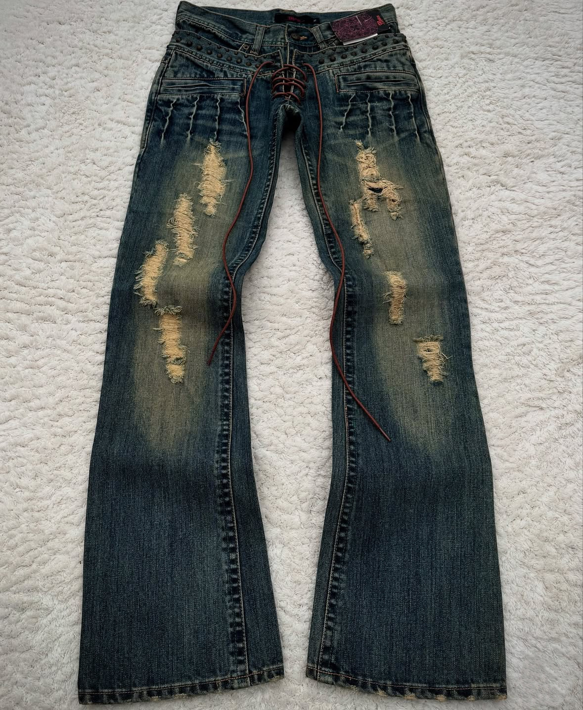 Vaqueros lavados milenarios de verano transfronterizos europeos y americanos estilo gótico retro micro-cuerno pantalones de cintura para hombres y mujeres en la calle