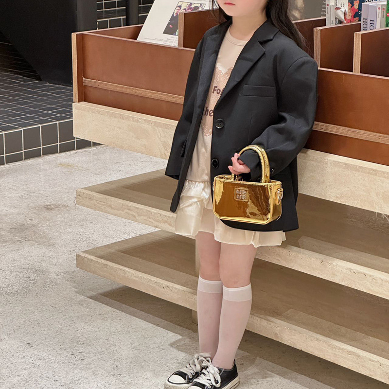 Bolsa de hombro coreana para niñas de color sólido, bolso láser de moda, mini bolso para bebés, 2025 nuevo bolso para niños