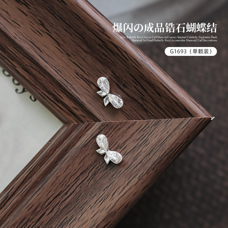 Nuevo estilo bowknot circón manicura de diamantes de lujo celebridades de Internet destellantes pequeños accesorios de lazo joyas de uñas de diamantes al por mayor