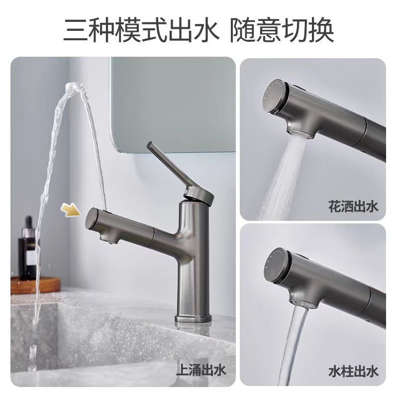 Pistola gris rociando agua