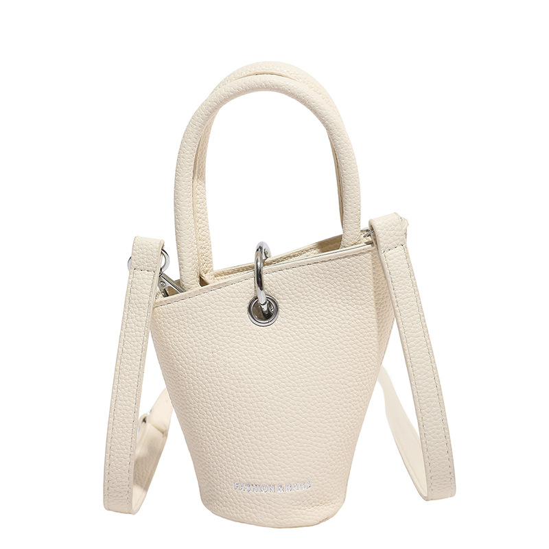 Bolso de cubo de diseño de nicho 2025 verano nuevo bolso de hombro con patrón de lichi mini bolso de mensajero de letras mujer