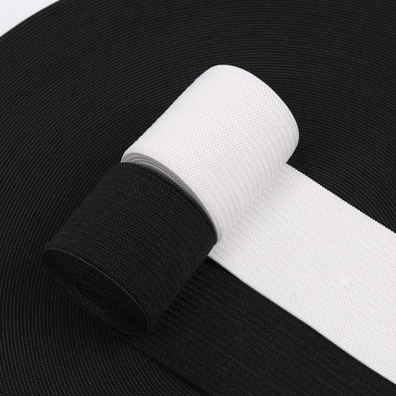 Elastic white knitted trousers, wholesale, on elastic band