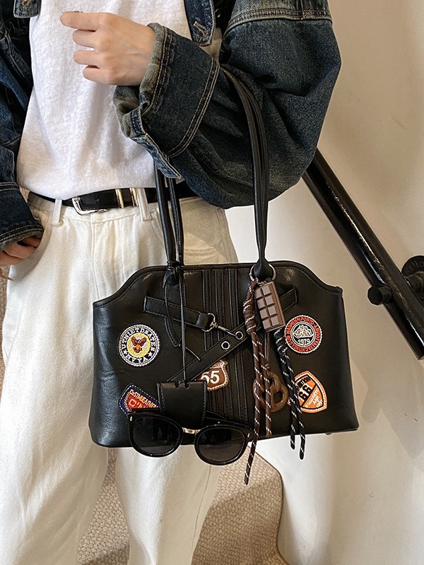 Insignia retro de gran capacidad hombro brazo bolso para mujeres 2025 nueva moda transfronteriza alta textura bolso