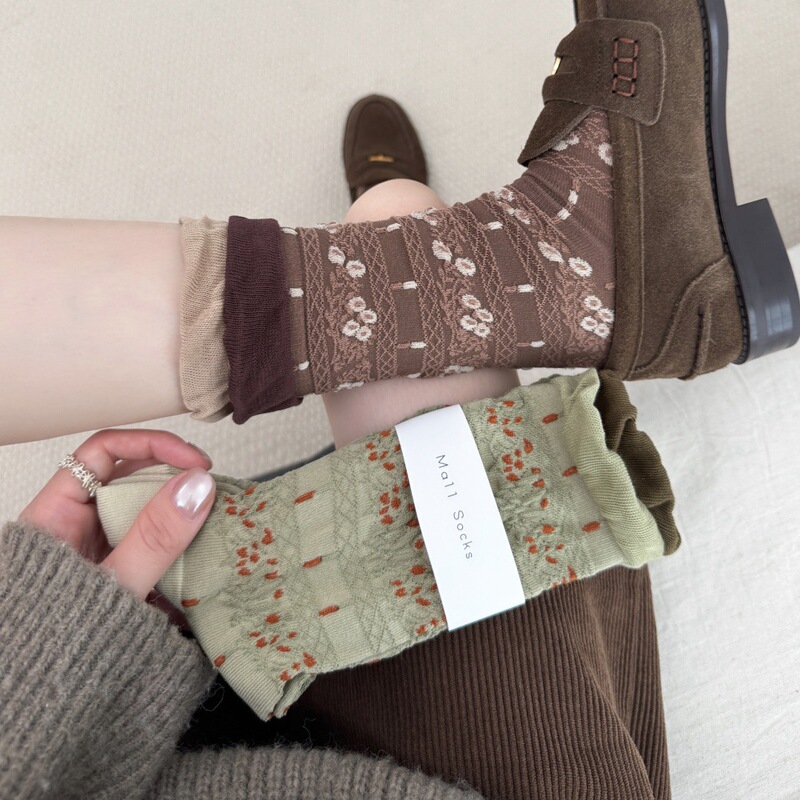 Autumn and winter seamless retro embossed court-style socks for women, featuring a forest-inspired floral pattern, subtle floral design, and a mid-calf length