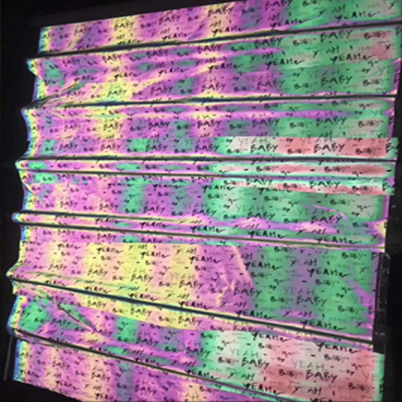 厂家七彩反光字母印花布休闲服装夜跑骑行反光面料镭射反光化纤布