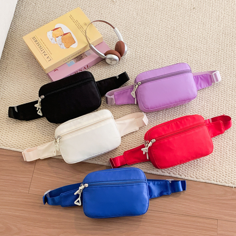 Coreano simple color sólido bolso de pecho para niños y niñas deportes ociosos bolso de mochila infantil 2026 bolso de cintura infantil transfronterizo