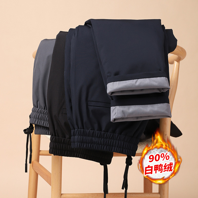 The brand's flagship product: elastic-waist, drawstring, down-filled pants with 90% white goose down, offering warmth, thickness, and wrinkle resistance, perfect for casual winter wear