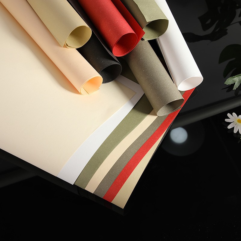 Fabricante mayorista de papel de hierba de color retro papel de fibra de pulpa de madera hermosa caja de regalo embalaje papel especial