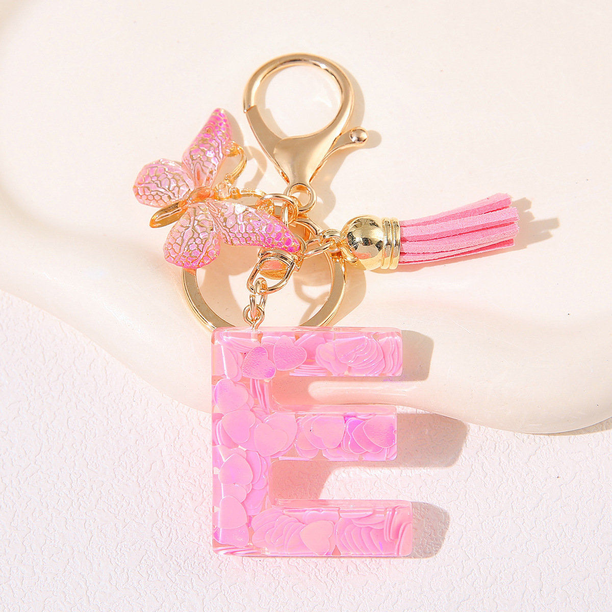 Nuevo rosa damas letras A-Z llavero de goteo de goma sequilla amor letras bordas mariposa llavero transfronterizo