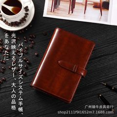 アマゾンの爆発的な牛革バインダーはビジネスのレトロな汎用メモ帳を挟んでノートの手帳を収納する