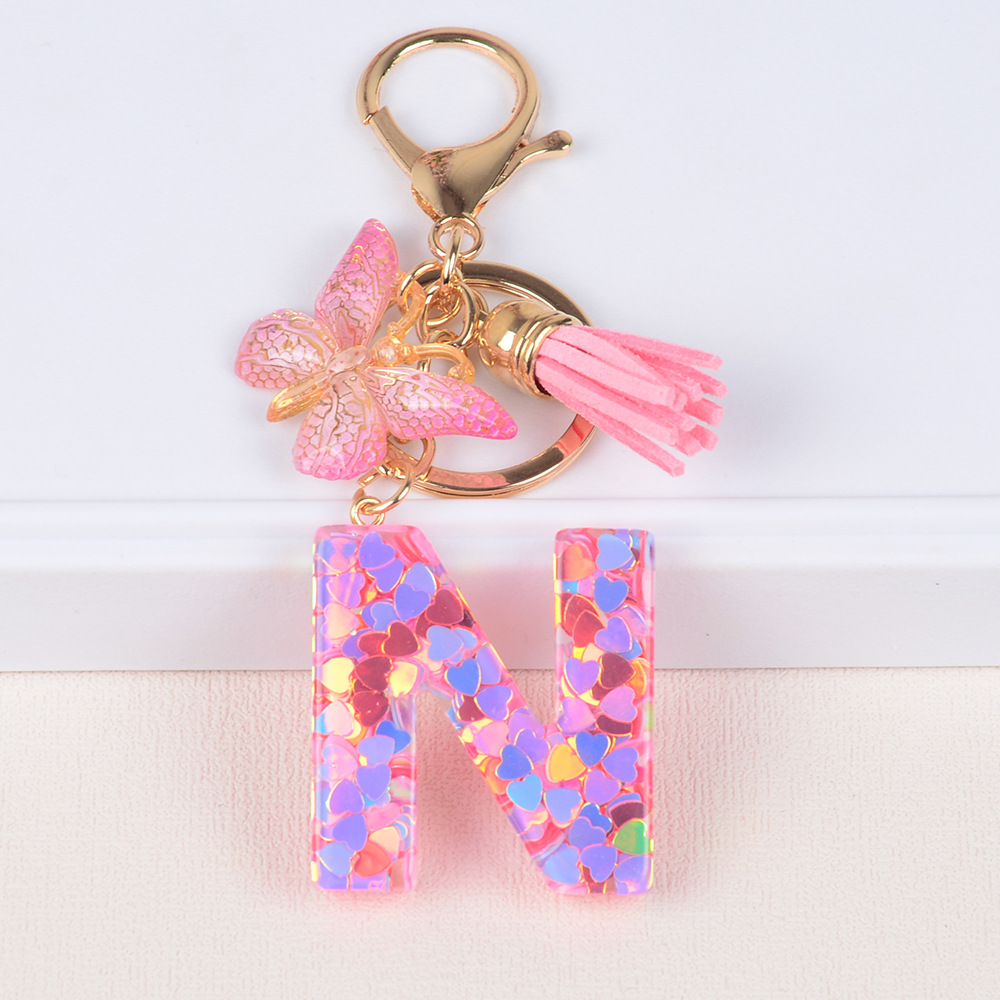 Explosiones transfronterizas amor sequillas iniciales llavero al por mayor resina letra mariposa fringe llavero se puede personalizar