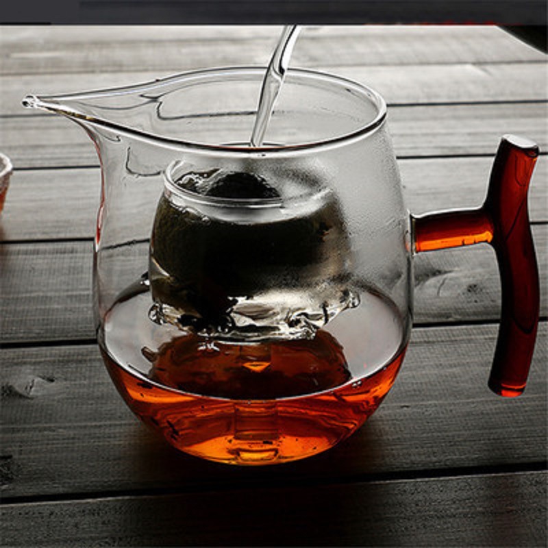 Fábrica al por mayor resistente al calor de alta temperatura de vidrio resistente pequeño verde naranja tetera hirviendo especial tetera Kung Fu taza de té hirviendo