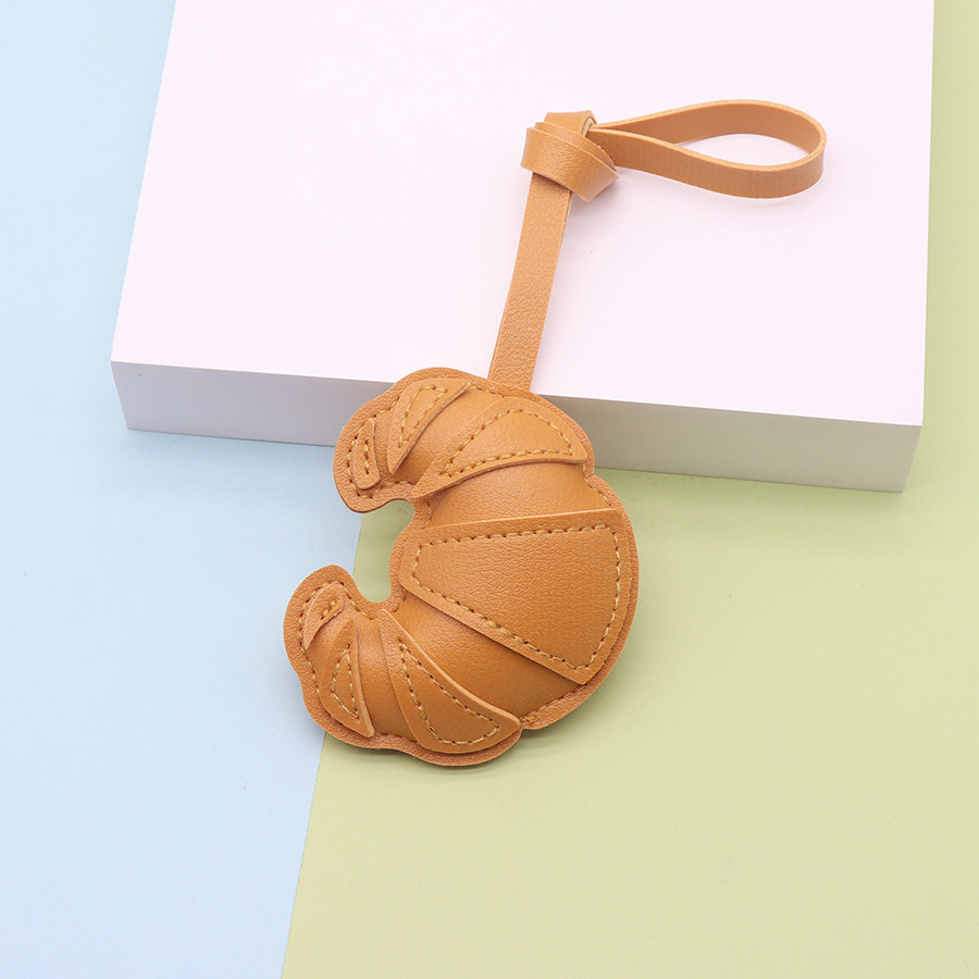 Moda y creatividad cuero de imitación hecho a mano bolso de cuerno hebilla colgante colgante bolso hecho a mano colgante fábrica al por mayor