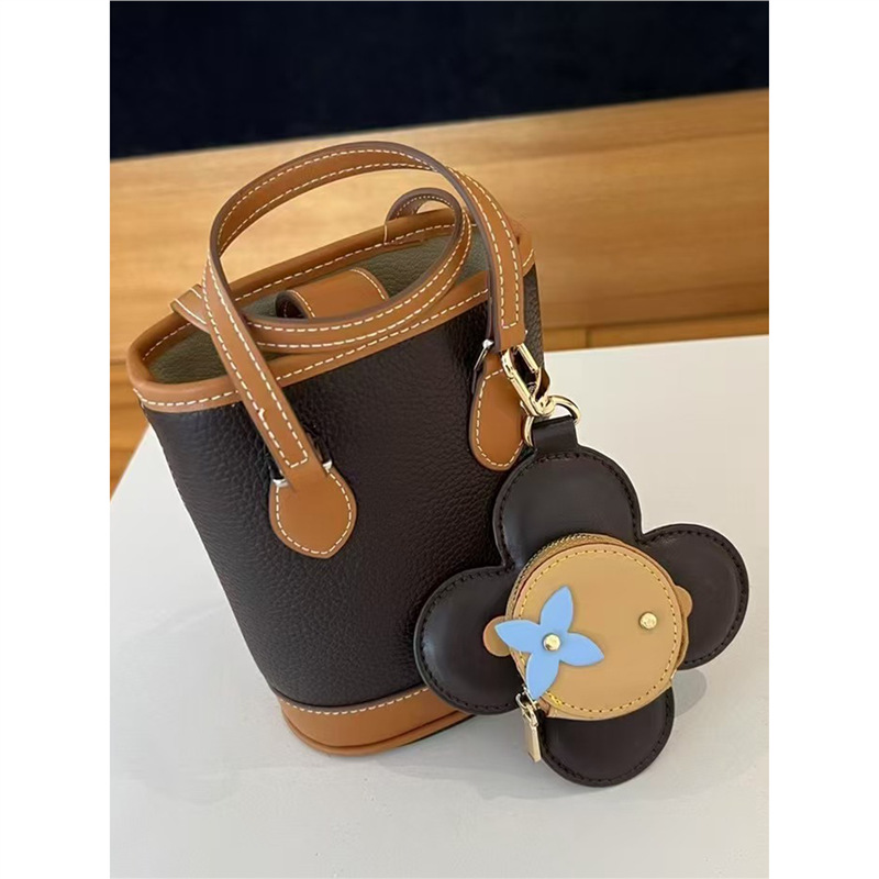 2025 nuevo solar flor de llaves bolsas de monedas bolsas de nicho de cuero bolsas colgantes bolsas de polvo de auriculares